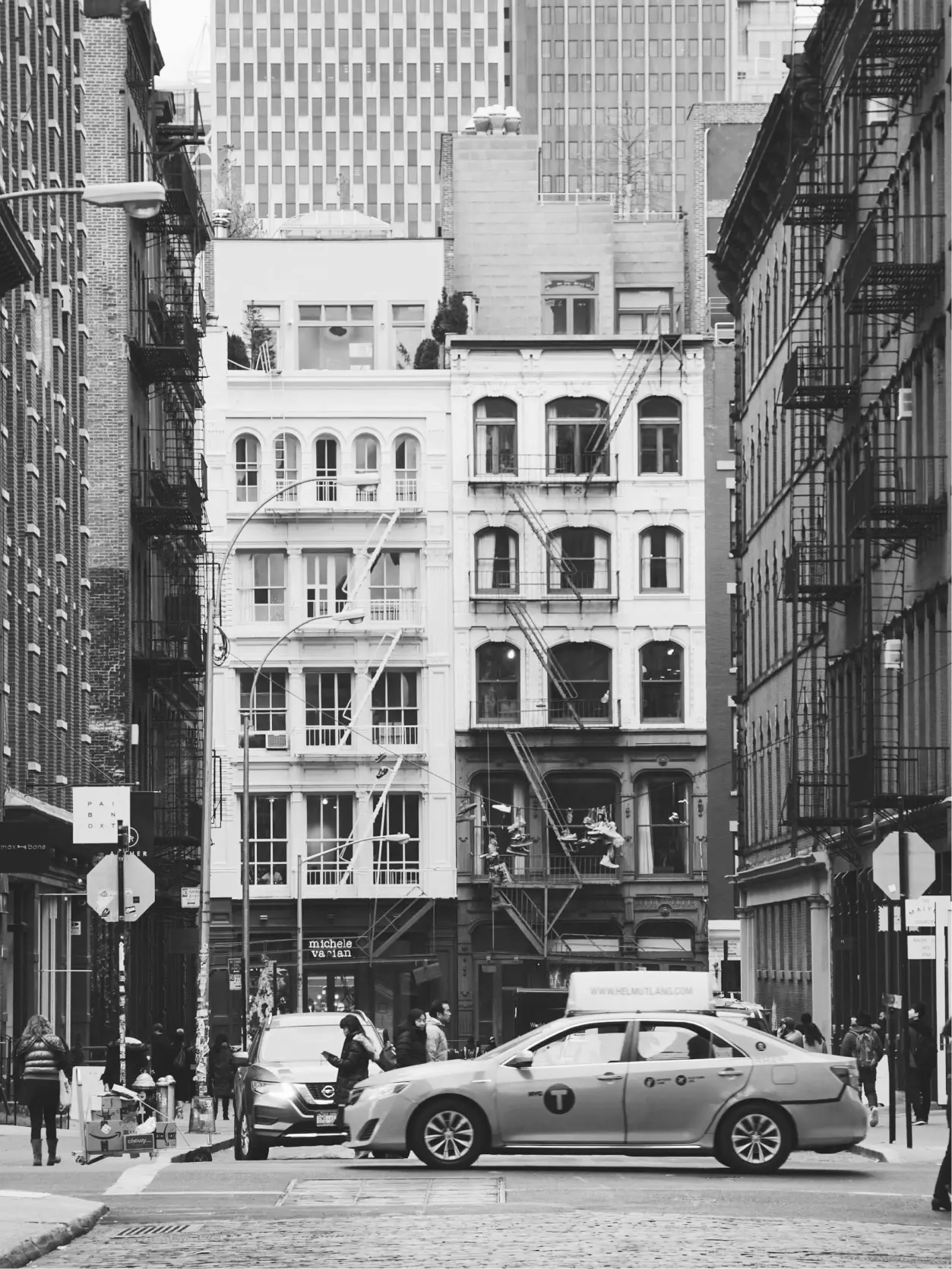 Photo of NYC cab with apartment building in the background